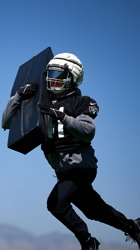 Raiders 4K Wallpaper with Blue Background for Phone