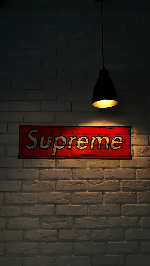 Supreme white brick wall red logo low light 4k image